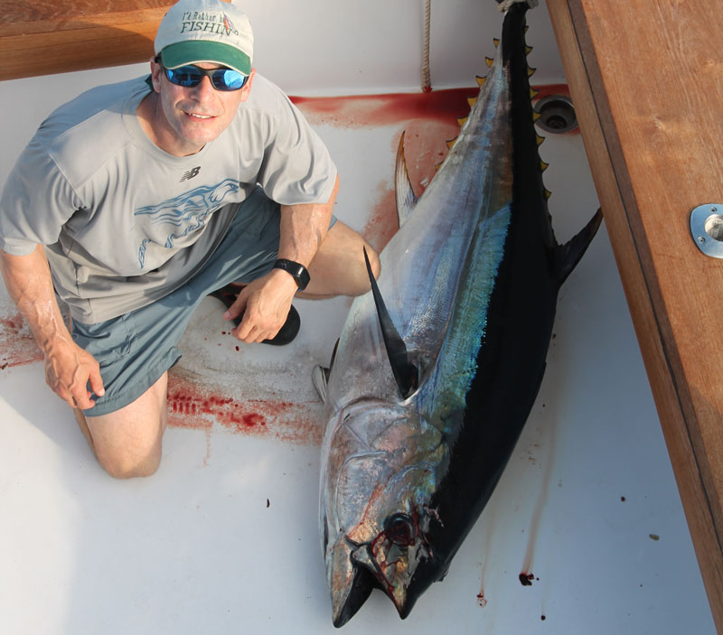 angler with a bigeye tuna
