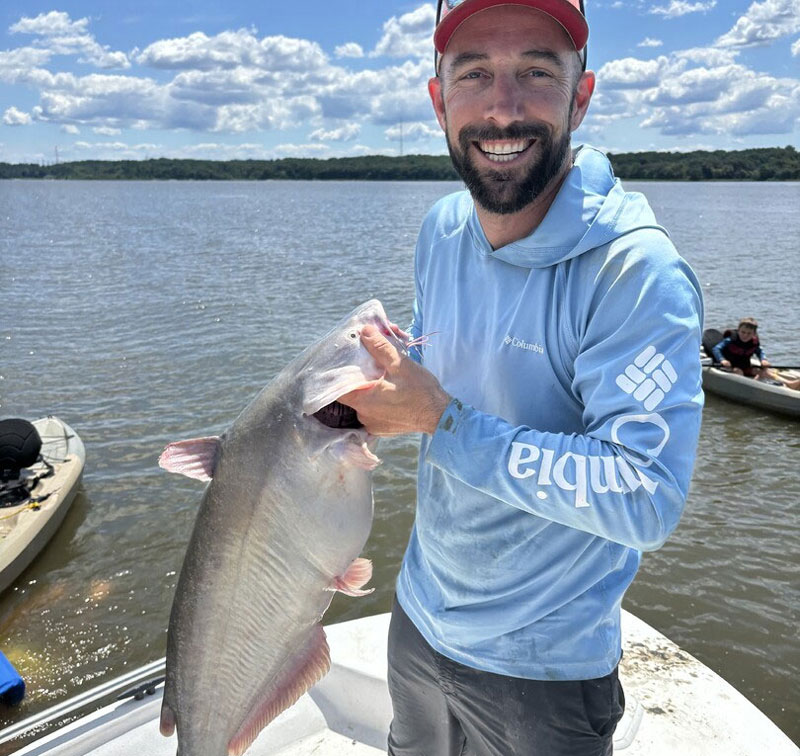 angler with a blue catfish for dinner
