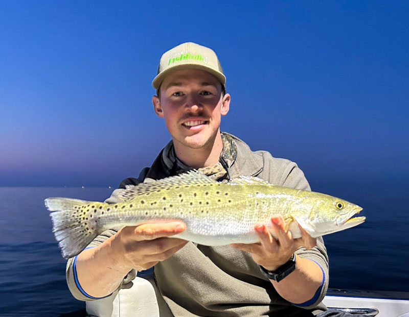 fishing reports editor dillon waters with a speckled trout