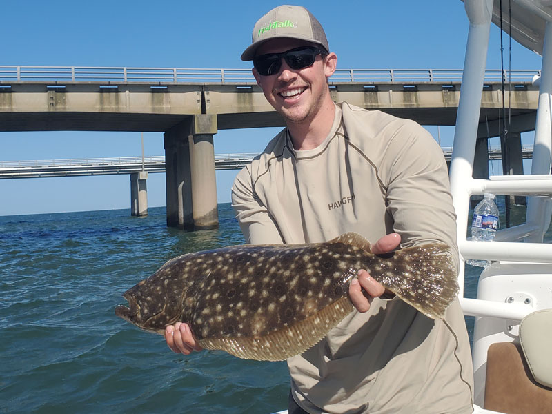 angler with a flounder caught at the cbbt