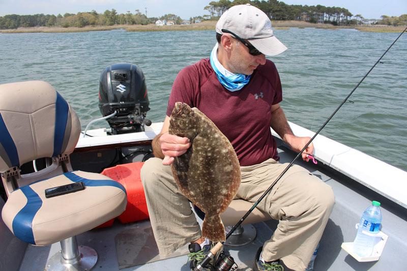 fisherman with a flounder in ocean city