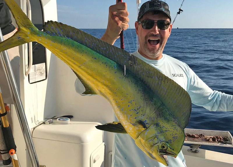 angler with a mahi-mahi