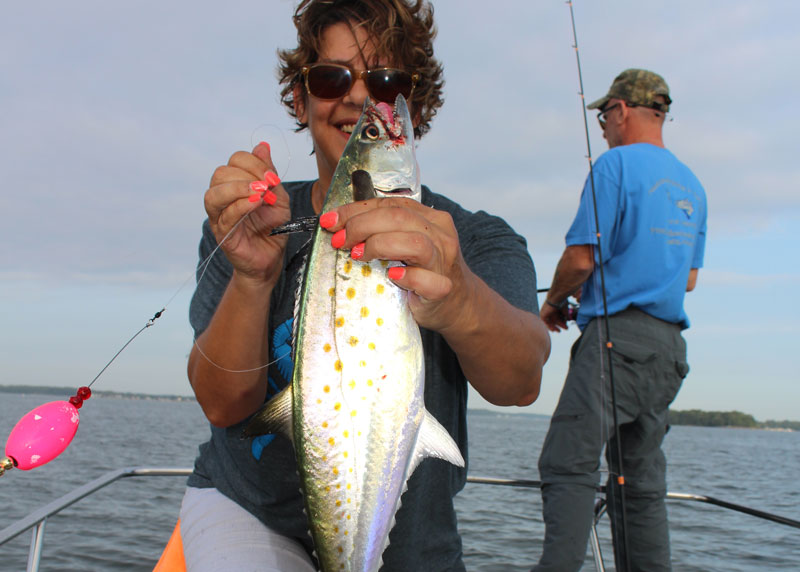 woman caught a spanish mackerel on a popping cork rig
