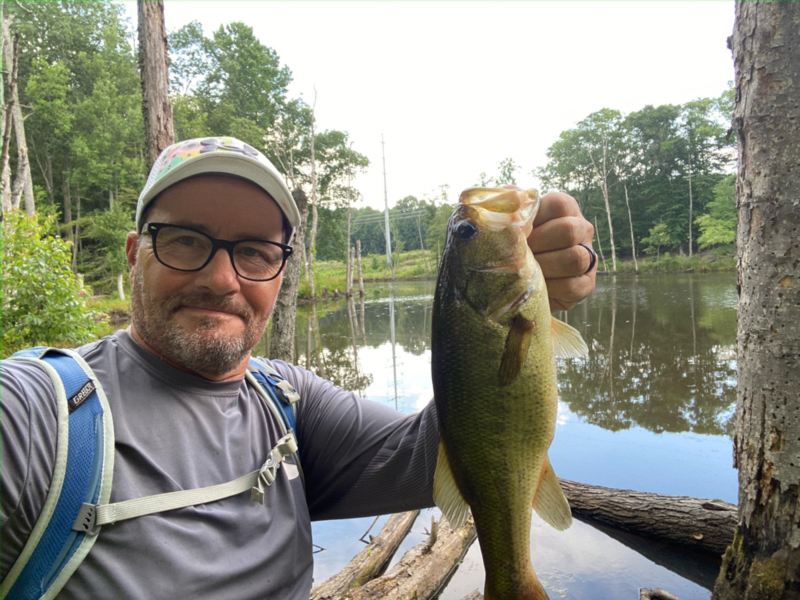 author holding a bass