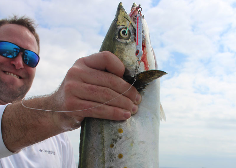 angler with a spanish mackerel caught at the stone rock